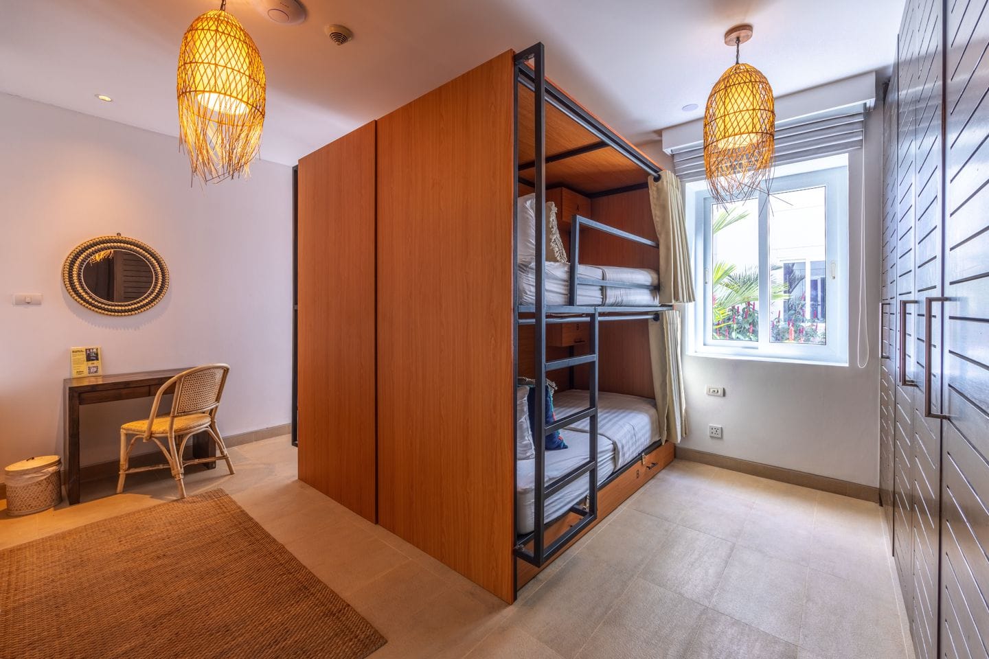 Modern four-bed dorm room with bunk beds